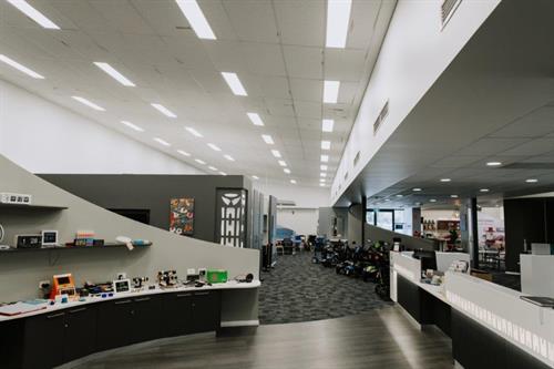 Experience Centre_Floor shot Clock and time display with customer service desk and whole display floor