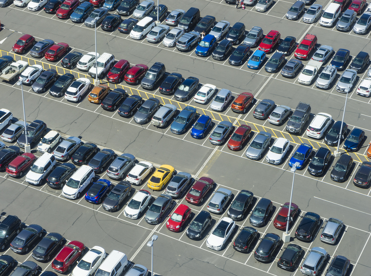 multi-coloured cars lined up in a car park