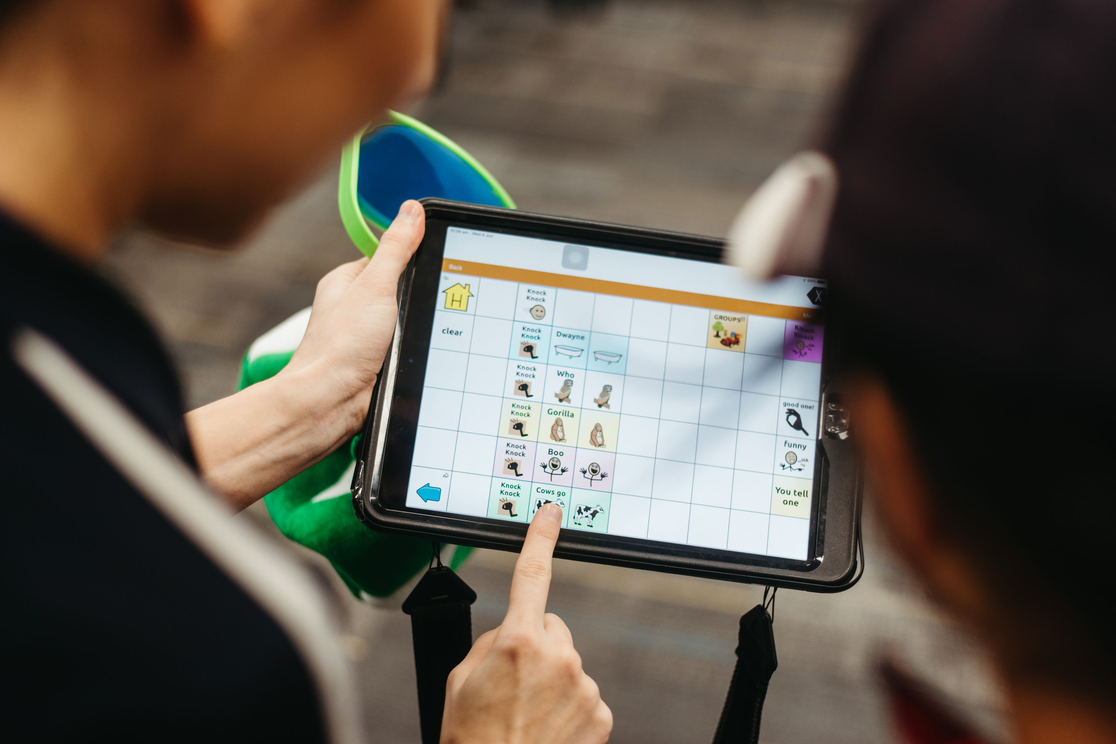 staff pointing to ipad main focus